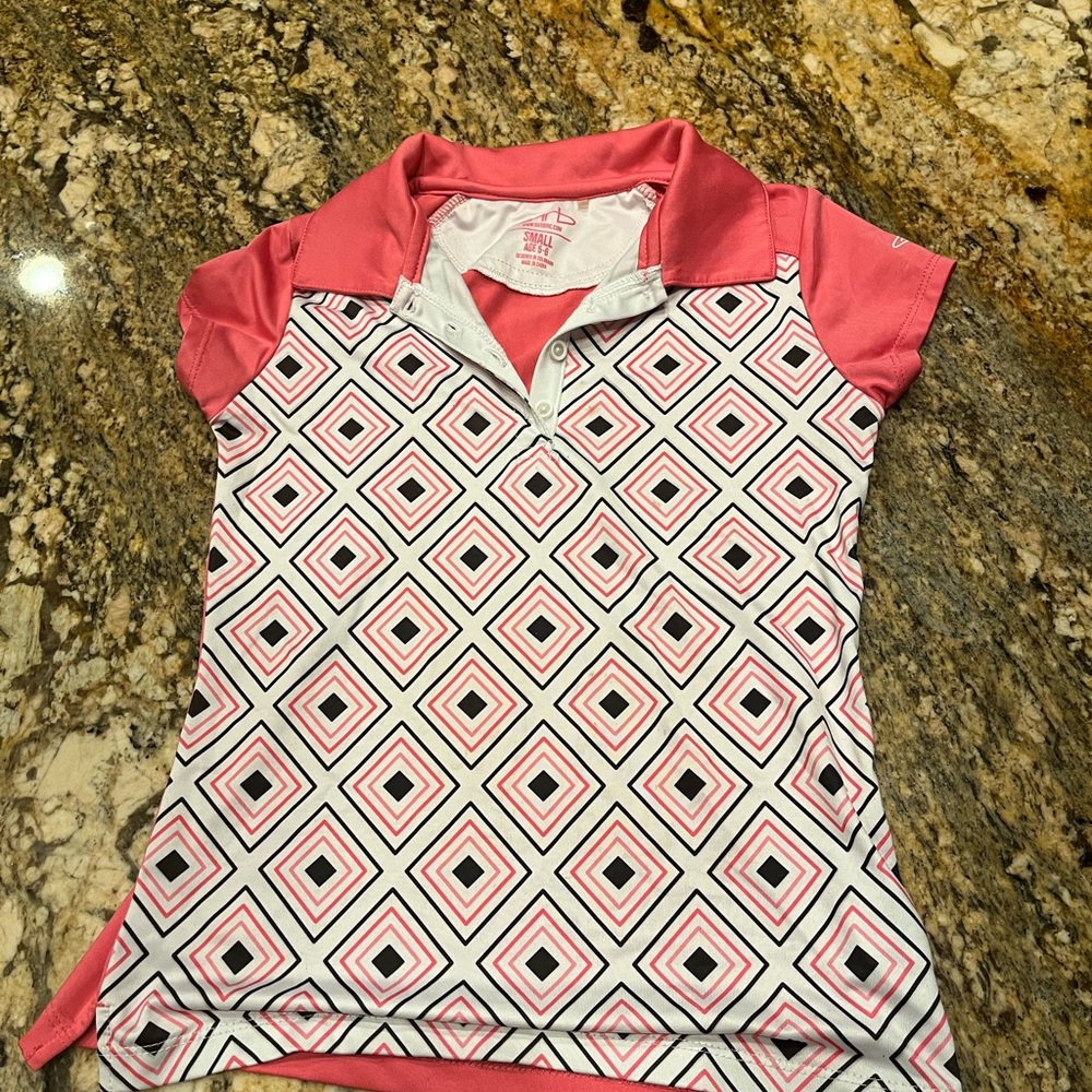 Girls golf T-shirt. Brand is Garb. Colors are bunk black and white. Size 5-6.